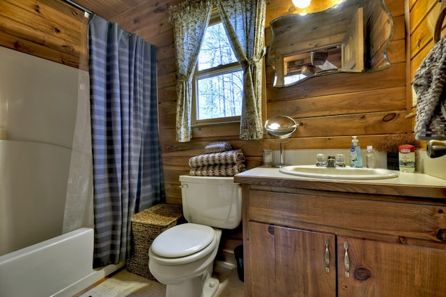 bathroom featuring wooden walls, shower / bath combination with curtain, toilet, and vanity