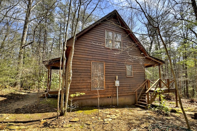 view of side of home with crawl space