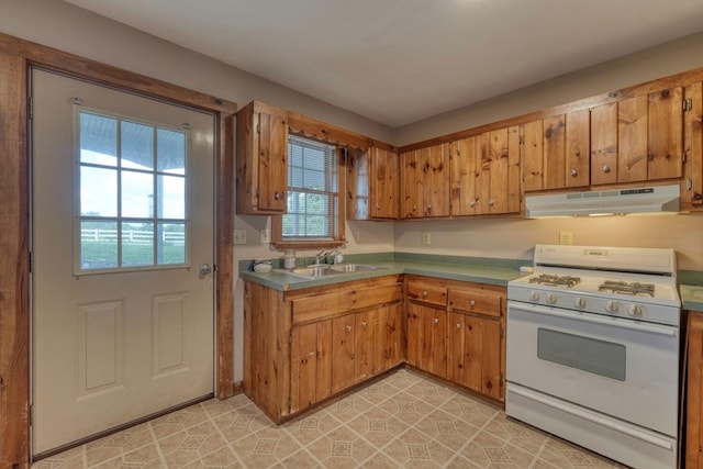 432 Jewell Mason, Blairsville, GA 30512 - kitchen with white range with gas stovetop, under cabinet range hood, and brown cabinetry