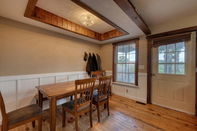 432 Jewell Mason, Blairsville, GA 30512 - dining space with light wood finished floors, a wainscoted wall, and a decorative wall