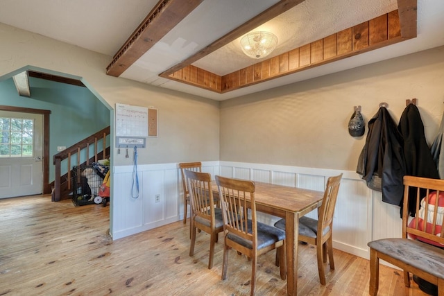 432 Jewell Mason, Blairsville, GA 30512 - dining room featuring wood finished floors, a wainscoted wall, and a decorative wall