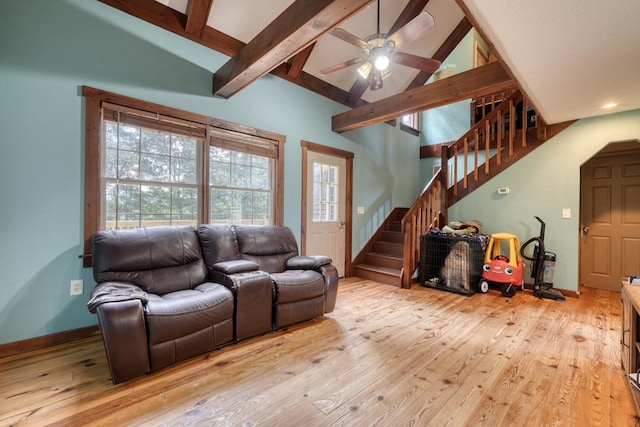 432 Jewell Mason, Blairsville, GA 30512 - living area with light wood finished floors, stairway, a ceiling fan, beamed ceiling, and high vaulted ceiling