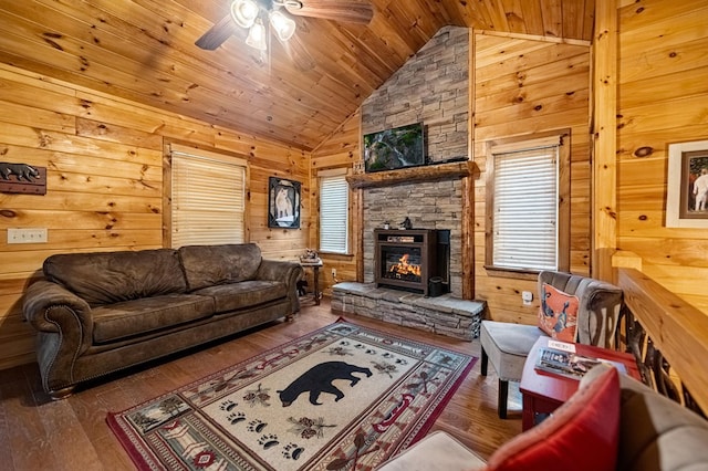 living area featuring wood ceiling, hardwood / wood-style floors, wood walls, and a wealth of natural light