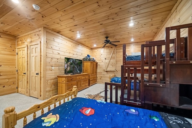 bedroom featuring carpet floors, wood ceiling, and wooden walls