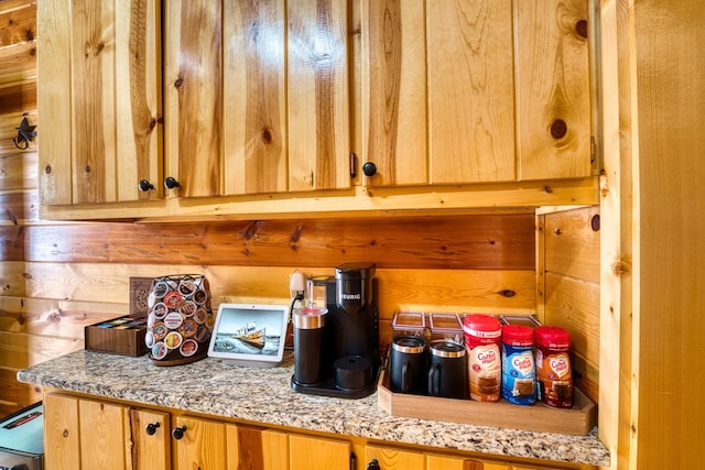 kitchen featuring wooden walls