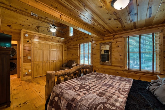 bedroom featuring wood ceiling, ceiling fan, wooden walls, and light hardwood / wood-style floors