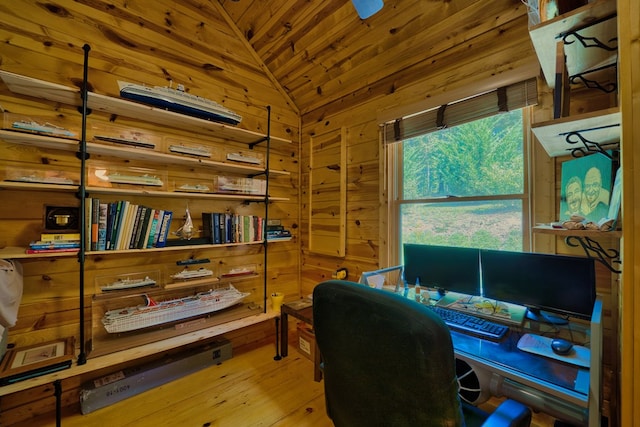 office featuring light hardwood / wood-style flooring, wood walls, wood ceiling, and vaulted ceiling