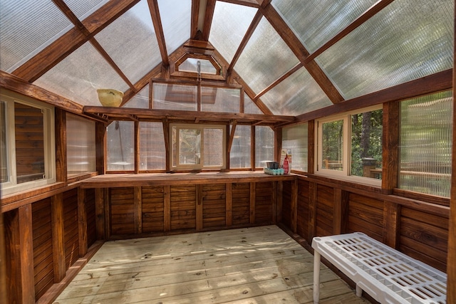 unfurnished sunroom featuring lofted ceiling