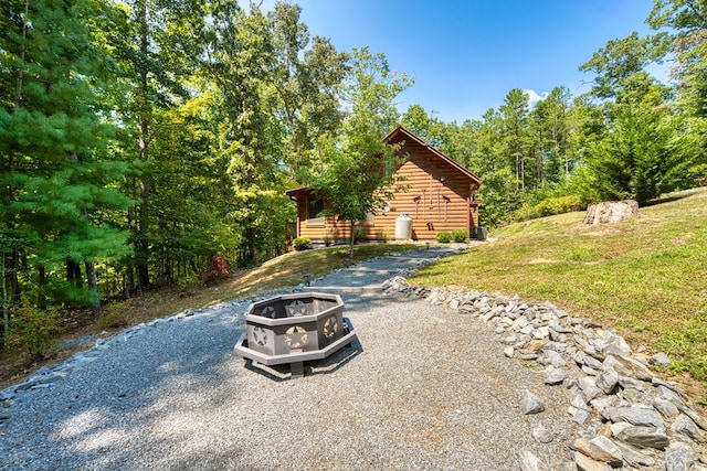 exterior space with a fire pit