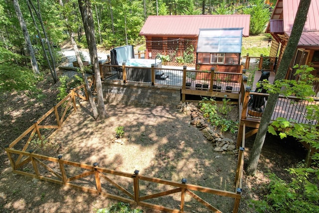 view of yard with a wooden deck and an outdoor structure