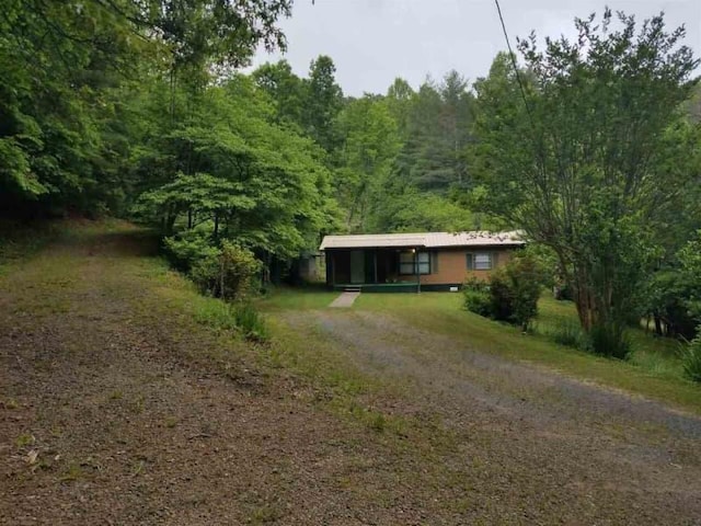 98 Ridgeview Dr, Morganton, GA 30560 - view of front of home with dirt driveway and a view of trees