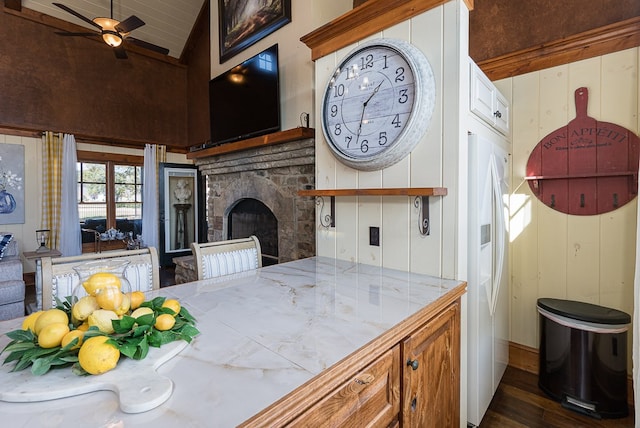 45 Bent Grass Cir, Hayesville, NC 28904 - kitchen featuring lofted ceiling, a ceiling fan, wood finished floors, a stone fireplace, and tile countertops