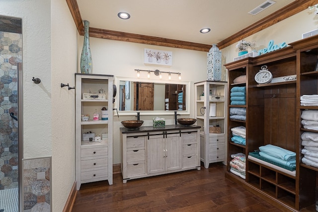 bathroom featuring wood-type flooring, a textured ceiling, crown molding, and vanity