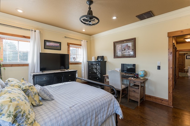 bedroom with dark wood-type flooring, a textured ceiling, and crown molding