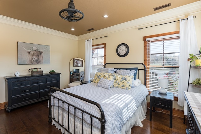 bedroom featuring dark hardwood / wood-style flooring and crown molding