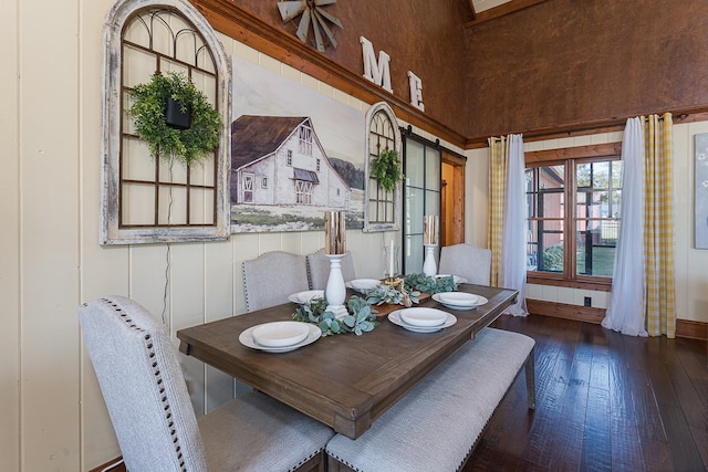 dining area featuring dark wood-type flooring