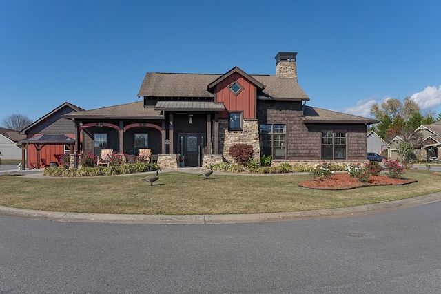 45 Bent Grass Cir, Hayesville, NC 28904 - craftsman house featuring a chimney, a front yard, stone siding, and board and batten siding