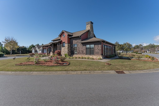 45 Bent Grass Cir, Hayesville, NC 28904 - view of front of property with stone siding, a chimney, a front yard, board and batten siding, and an attached garage