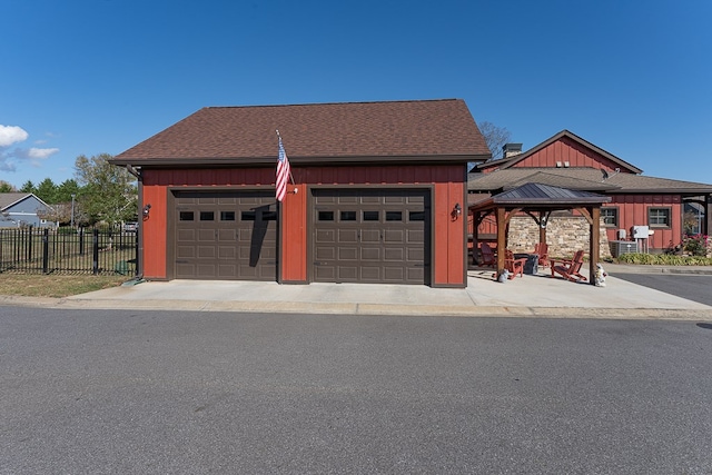 view of front of house with a garage and a gazebo