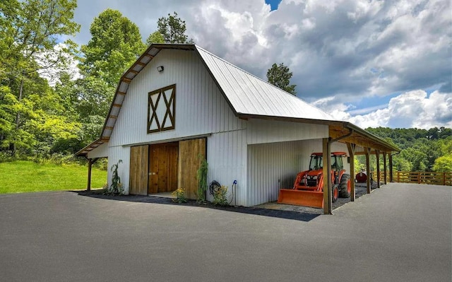 view of outdoor structure with a carport