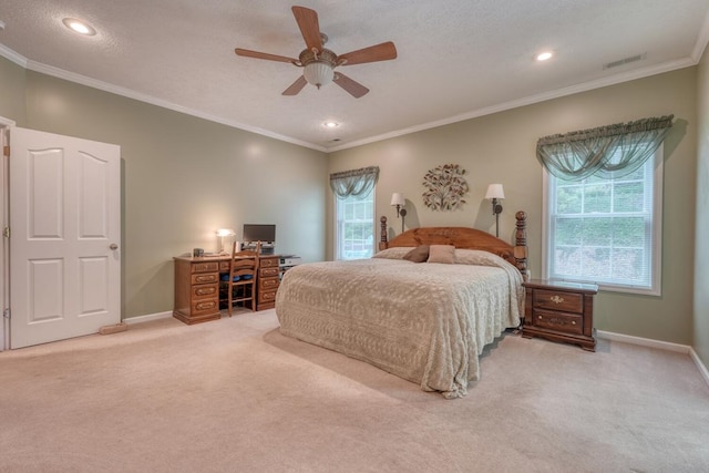 bedroom with baseboards, ornamental molding, carpet flooring, and visible vents