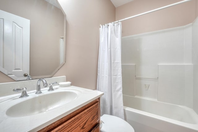 bathroom with vanity, shower / bath combo, and toilet