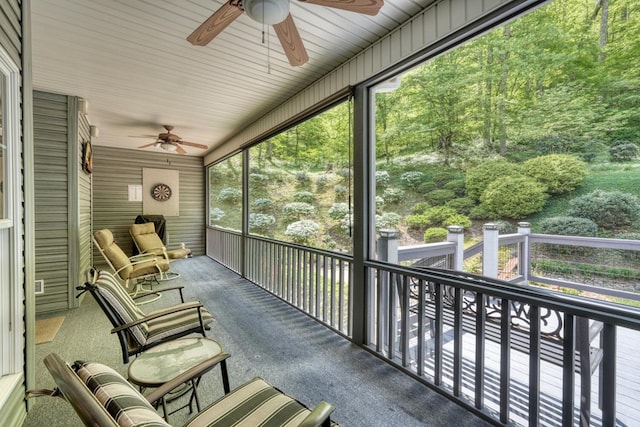 sunroom / solarium with a ceiling fan and a wealth of natural light