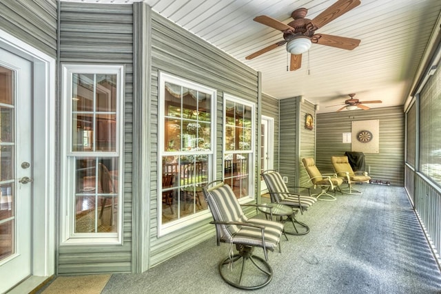 sunroom with a ceiling fan