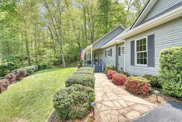 view of yard with covered porch