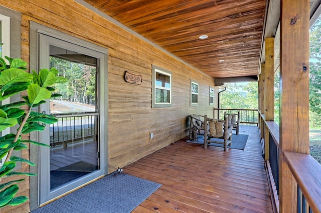 wooden terrace featuring a porch