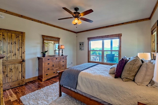 bedroom with ceiling fan, crown molding, baseboards, and wood finished floors