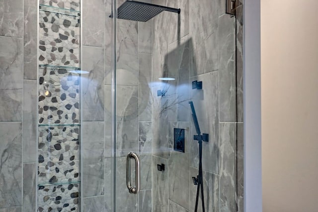 bathroom featuring a shower stall