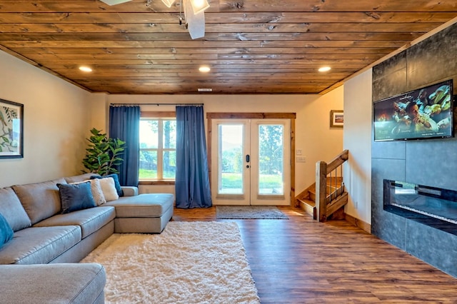 living room with stairs, french doors, wood finished floors, and wood ceiling