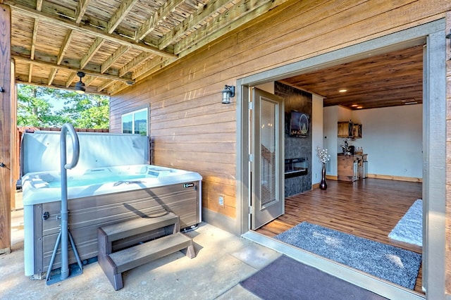 view of patio / terrace with a hot tub