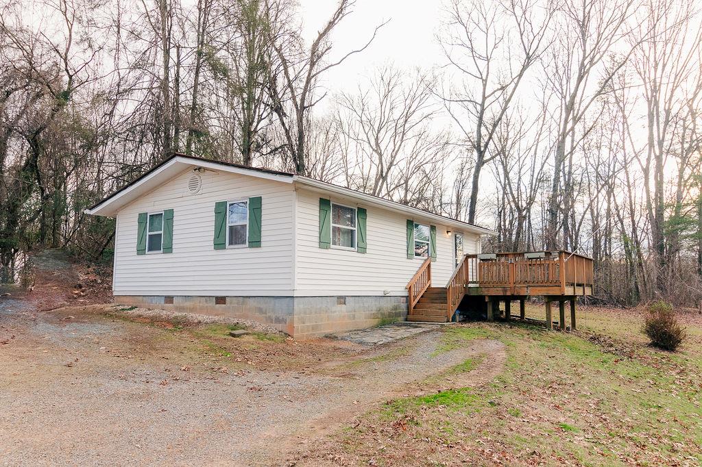 view of front of home with a wooden deck