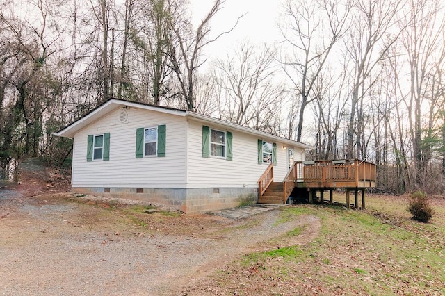 view of front of home with a wooden deck