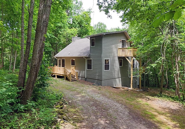 view of front of home featuring a wooden deck