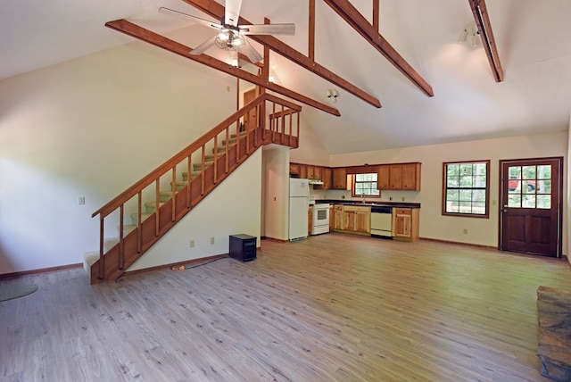 unfurnished living room featuring high vaulted ceiling, ceiling fan, hardwood / wood-style flooring, and beam ceiling