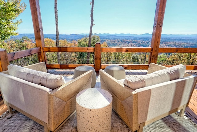 exterior space with an outdoor living space and a mountain view