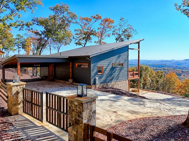 back of house with a mountain view