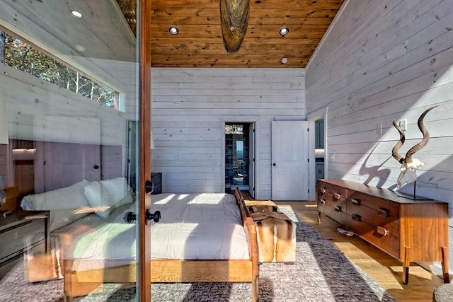 bedroom featuring recessed lighting, wooden walls, high vaulted ceiling, wooden ceiling, and wood finished floors