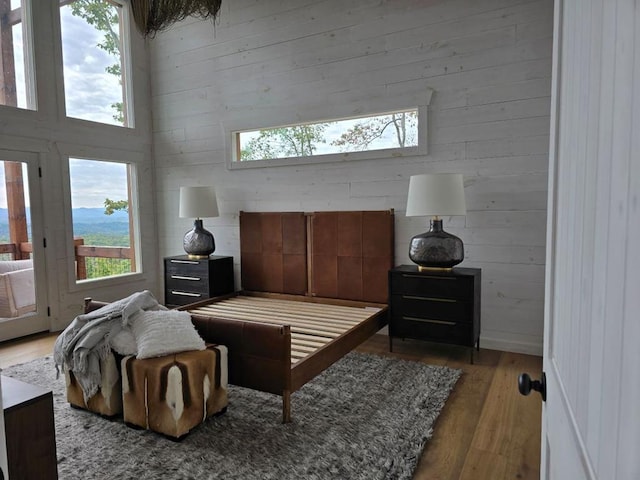 interior space with hardwood / wood-style floors and a high ceiling