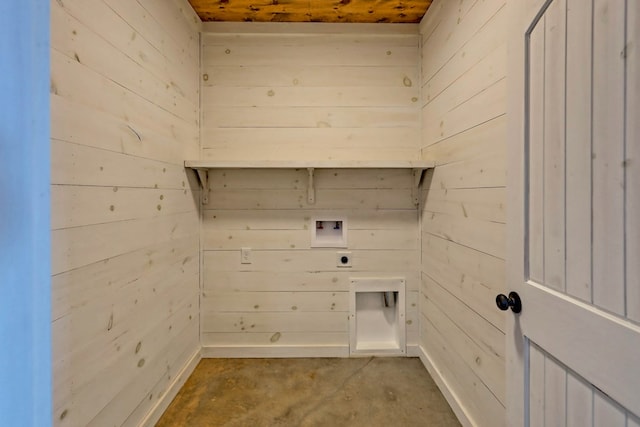 laundry area with wooden walls, laundry area, and hookup for a washing machine