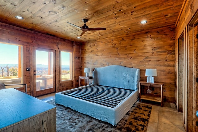 bedroom featuring access to exterior, wooden walls, wooden ceiling, and ceiling fan