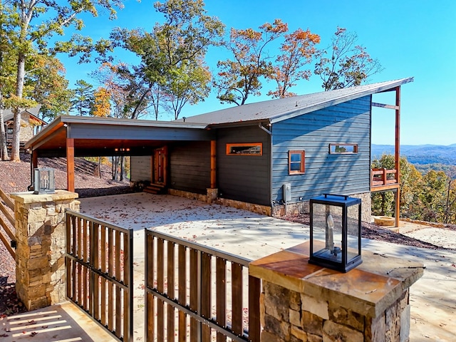 rear view of house with a carport