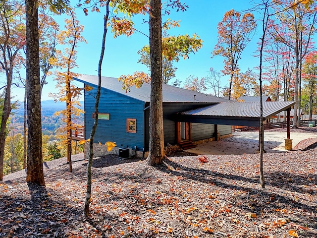 view of home's exterior with a carport