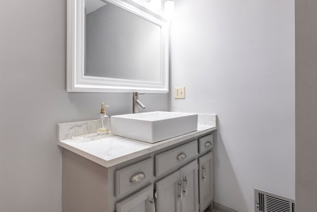 bathroom featuring visible vents and vanity