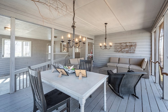 dining space featuring a chandelier and hardwood / wood-style floors