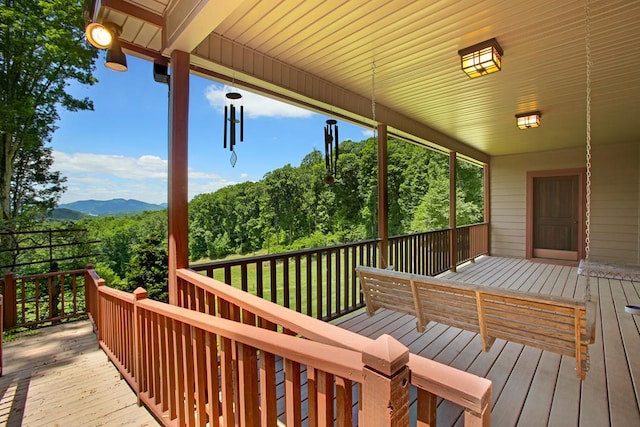 wooden deck featuring a mountain view