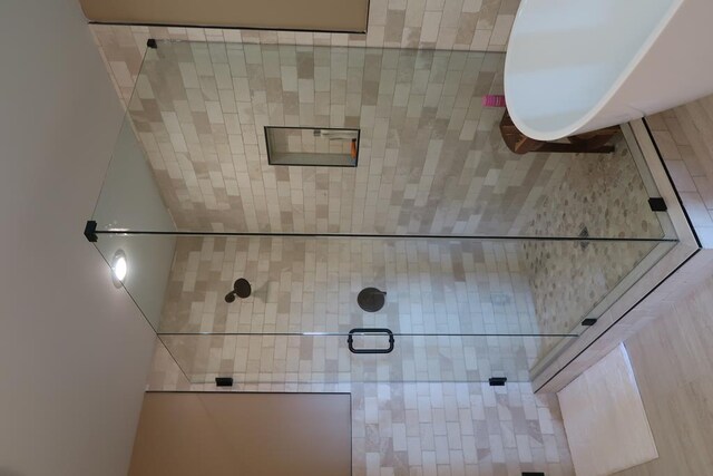 bathroom with a tile shower